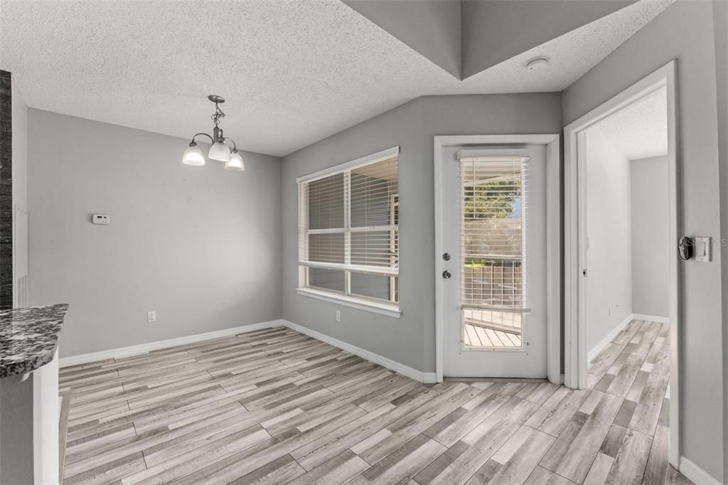 #13 - View of Dining Room, Door to Balcony, and Door to Bedroom 2