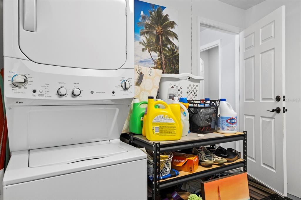 Stackable washer and dryer in a fantastically clean 1 car garage that does fit an SUV!