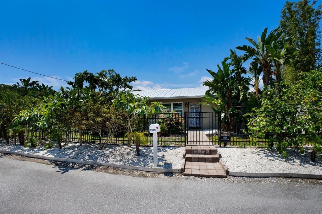 Front walkway to this modernized midcentury 3/2 in coveted Indian Beach neighborhood.