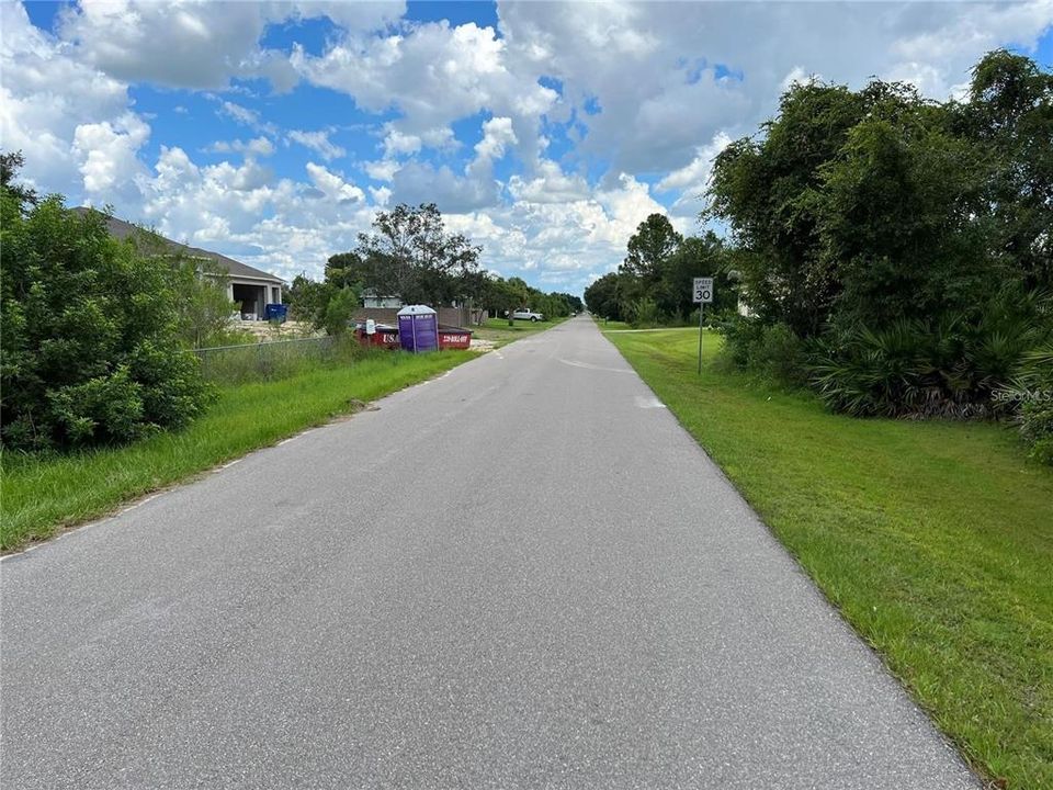 Street view looking east in front of the property