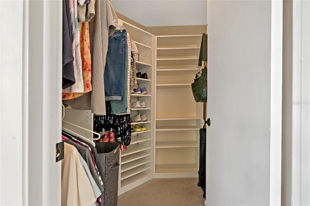 WALK IN CLOSET IN THE PRIMARY SUITE ~ GREAT CUSTOM ORGANIZING SYSTEMS IN BOTH CLOSETS!