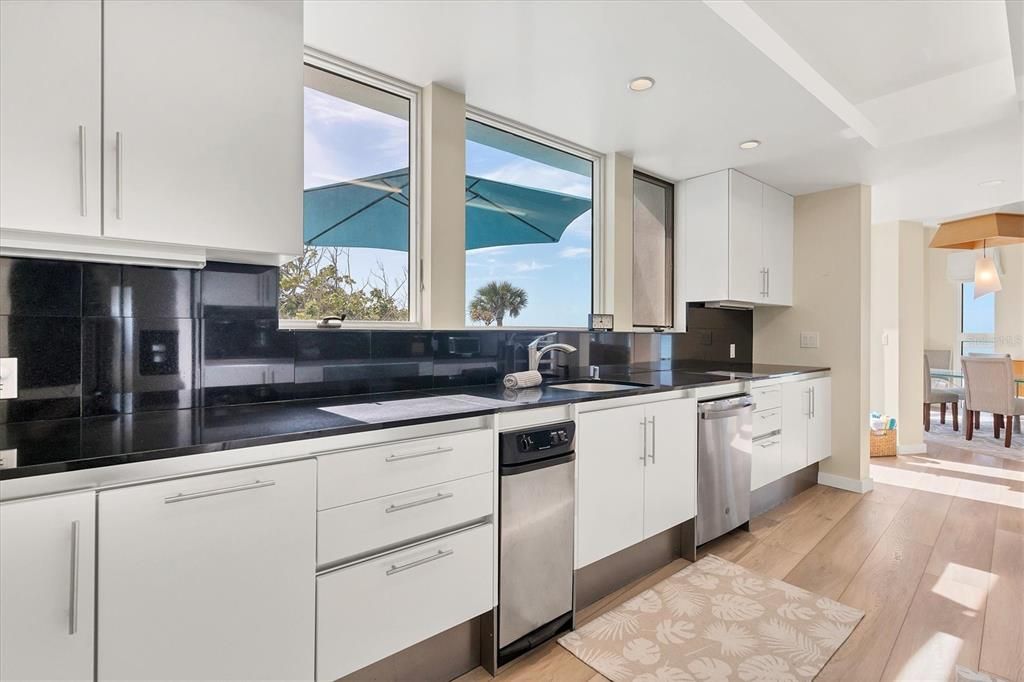 Kitchen overlooks pool.