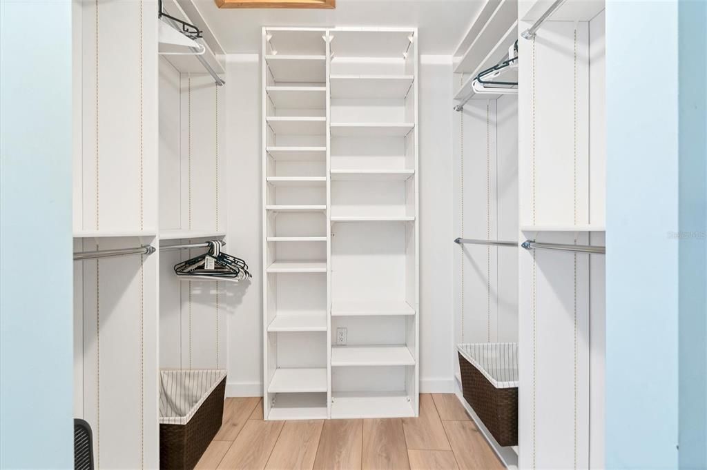 Walk in closet in primary bedroom.