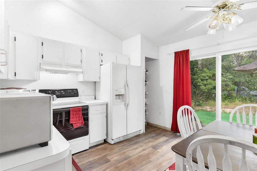 Kitchen with Sliding Doors leading to Backyard Area