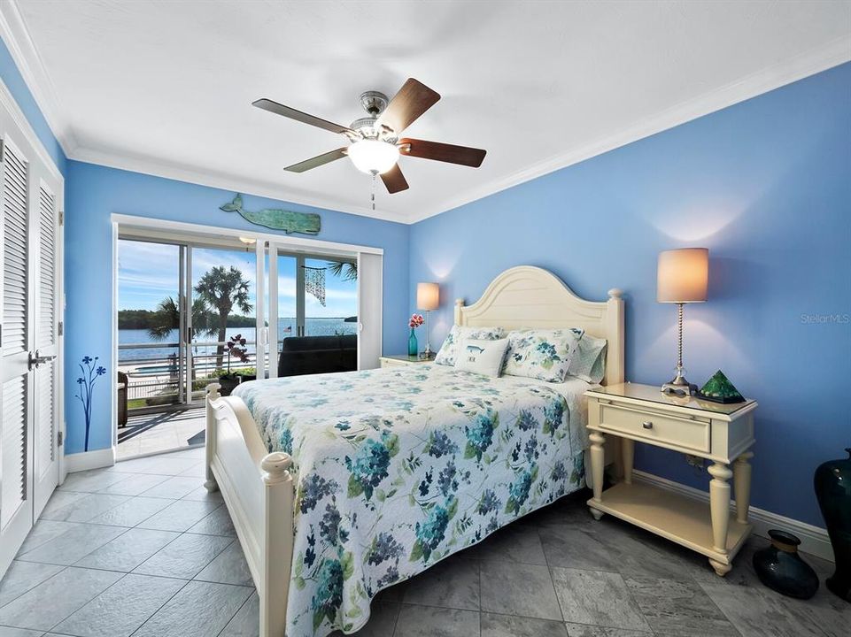 The 2nd bedroom also looks out to the lanai and the view through Impact resistant sliding doors