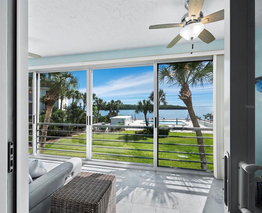 The view through heavy Impact resistant Sliding doors from the primary bedroom