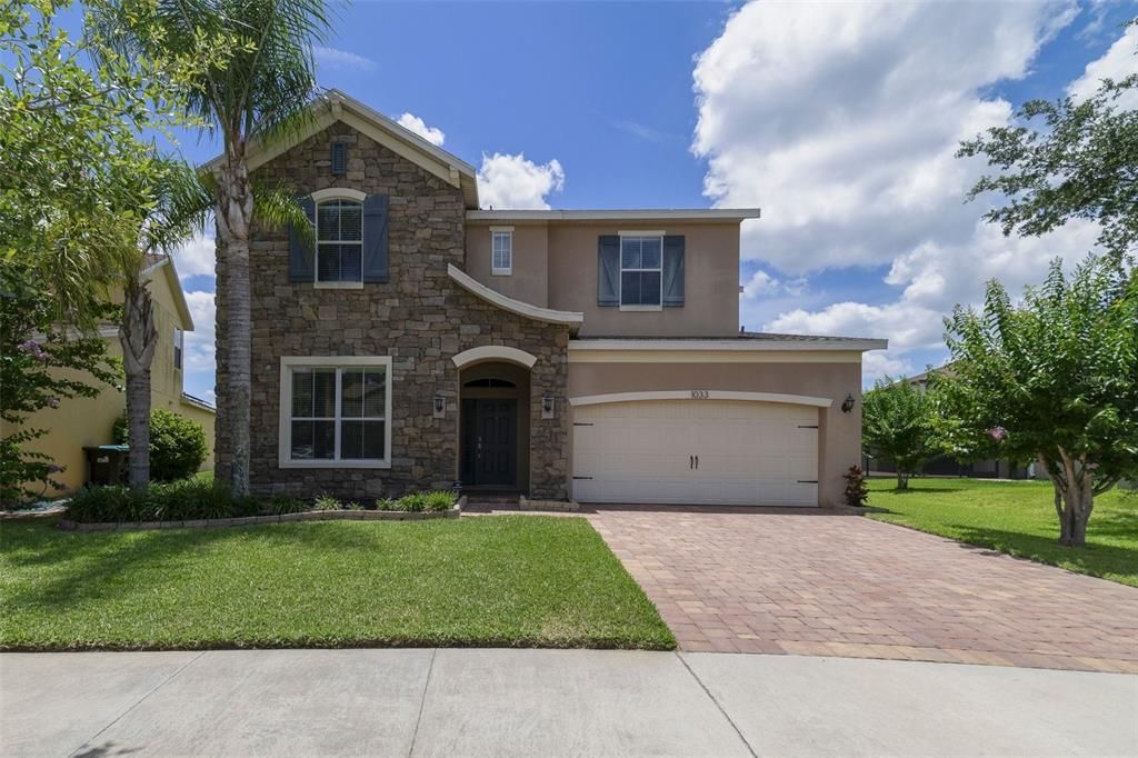 East Orlando gem in the sought-after community of The Reserve at Golden Isle with plenty of room to grow in 4-bedrooms and 3-full baths on a large lot with POND VIEWS!