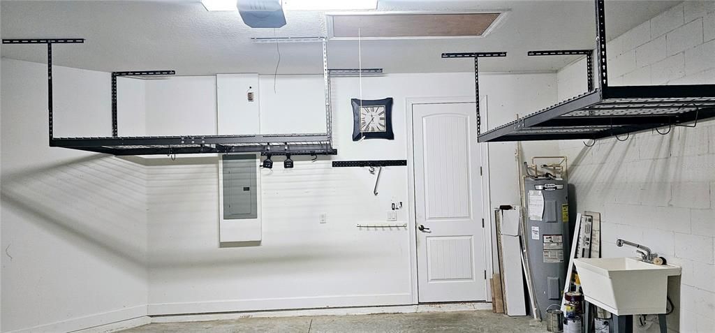 Two car attached Garage with ample Ceiling Rack storage, new Automatic Garage Door Opener and a Laundry Tub.