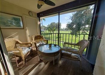 Screened porch and golf course view