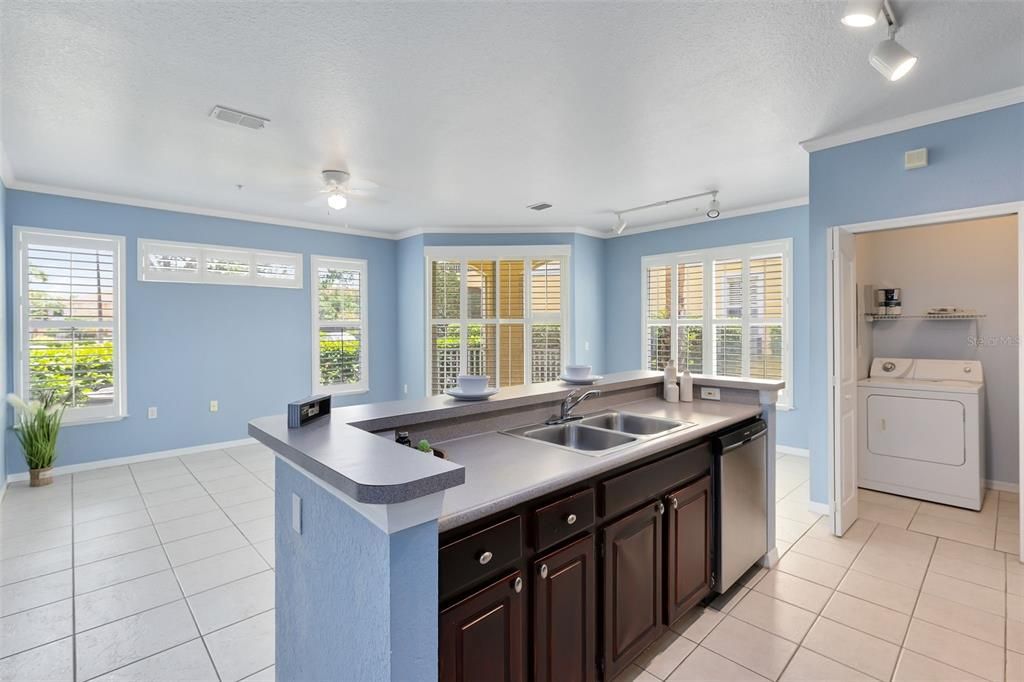 Kitchen with View to Living Room/Dining Room Combo & Laundry Room