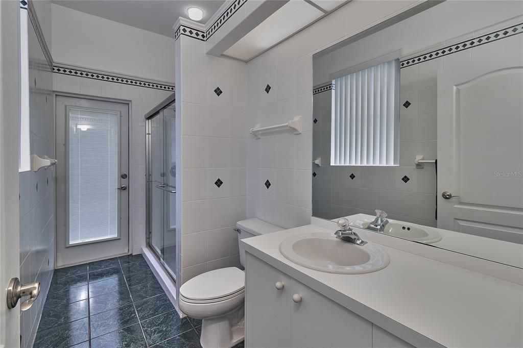 FULL BATHROOM WITH ACCESS FROM POOL AREA