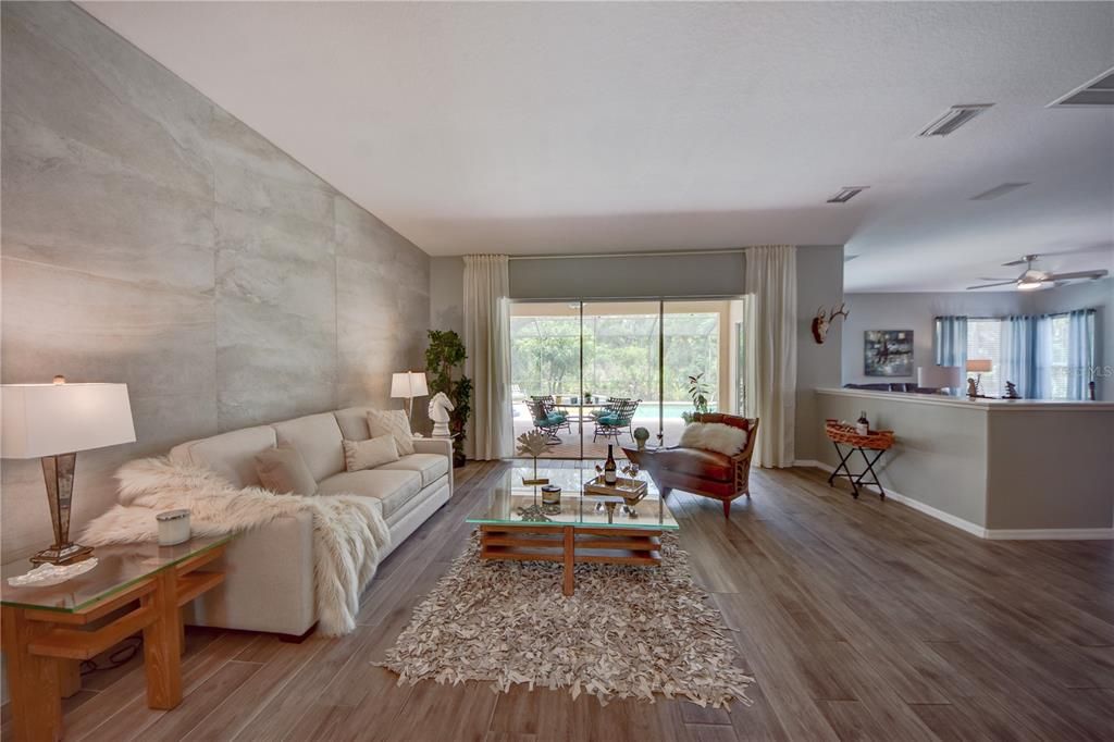 Beautifully Updated Family Room W/ Sliders Leading to Pool/Lanai and Pool Bathroom