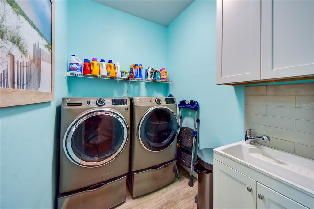 Indoor Laundry Room Updated W/ Utility Sink/ Cabinets and a Pocket Door