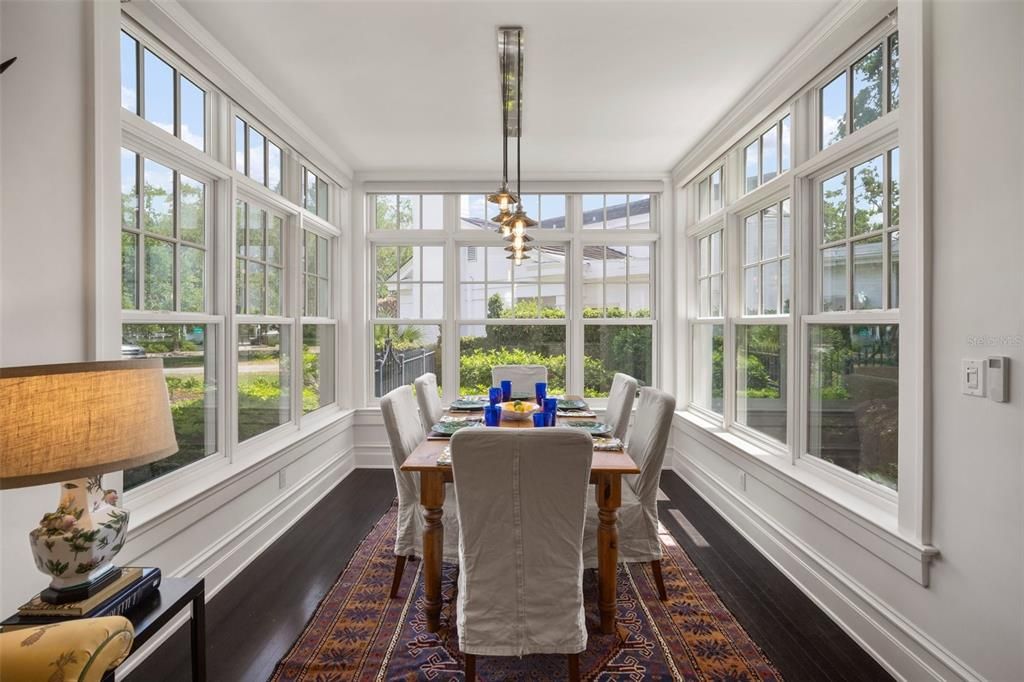 GLASS-WRAPPED BREAKFAST ROOM WITH MOTORIZED SHADES