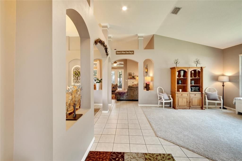 Living room on right, family room ahead and dining room to the left