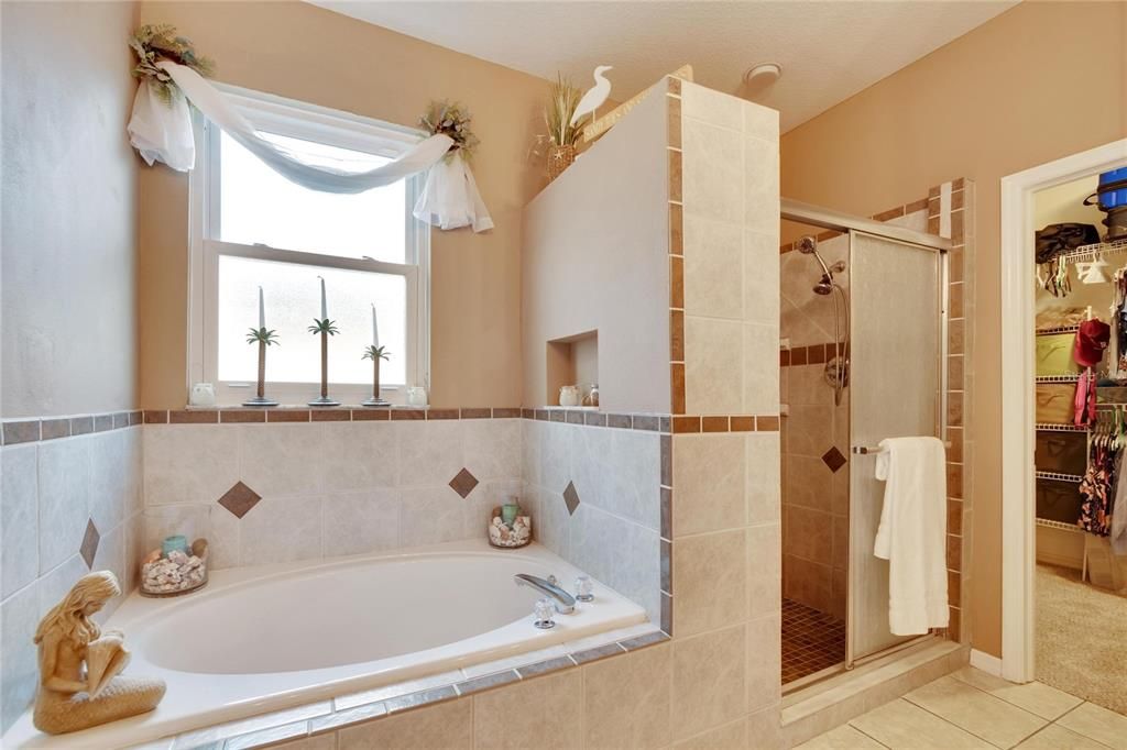 Garden tub and separate walk-in shower with bench seat