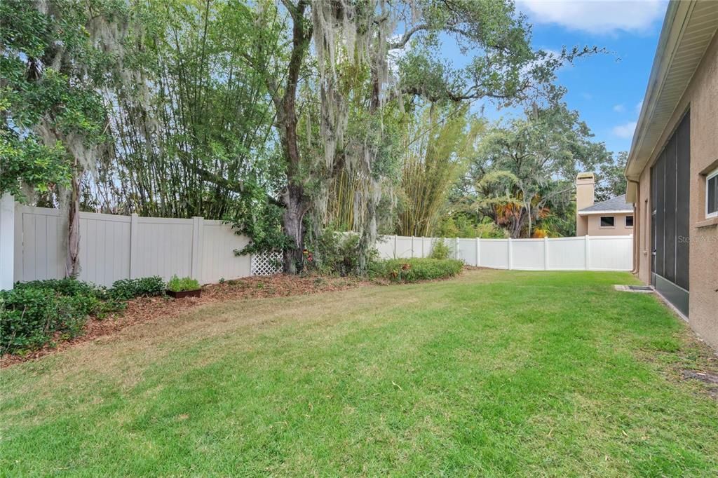 Fenced-in yard has space to play and garden