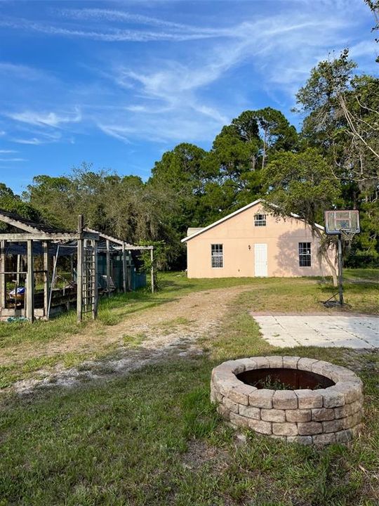 firepit, green house, detached garage with workshop