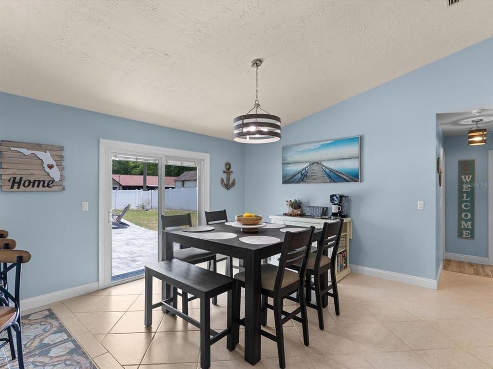 Dining area with sliders to backyard