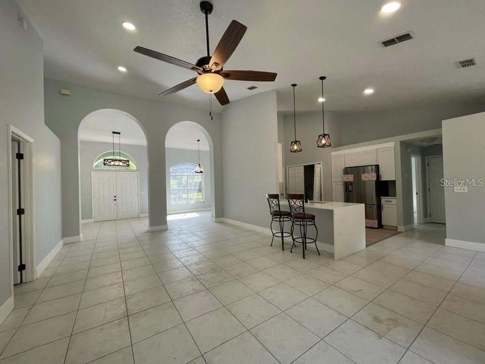 View of the Kitchen, Dining room and front entrance from the Family room, Master on the left side