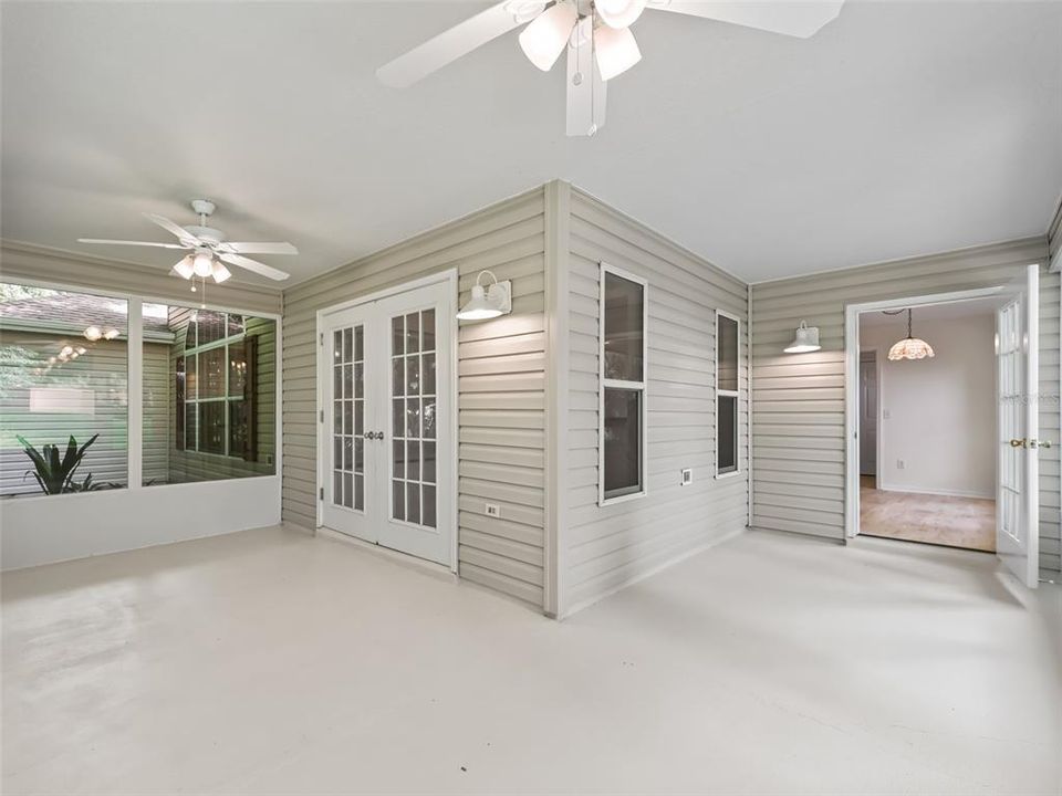 Lanai to dining room, can  241 SF of usable living space any season which is not included in sf. of living space of the home. The floor in the dining room is a gray as the rest of the home, not brown as shown here. All floors are new LPV in a stone color. See other photos of the fl.