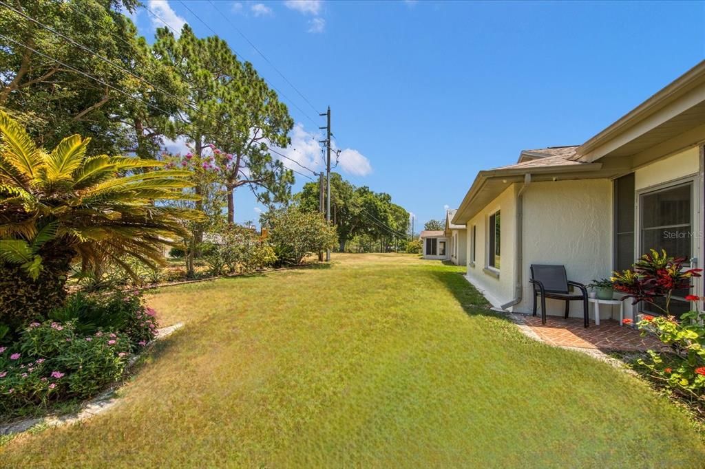 Newer landscaping at the perimeter of the back yard provides gorgeous views and privacy too~