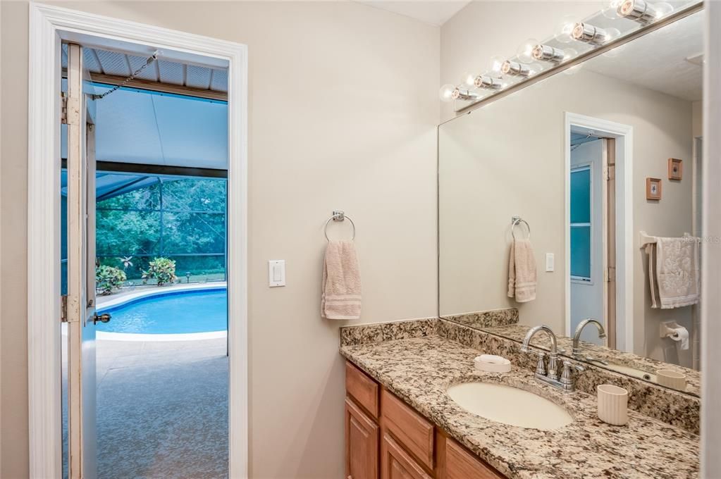 Primary bathroom with direct access to screened lanai and pool!