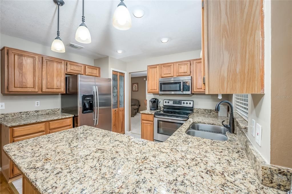 Kitchen - plentiful counter space, glassed pantry, stainless steel appliances