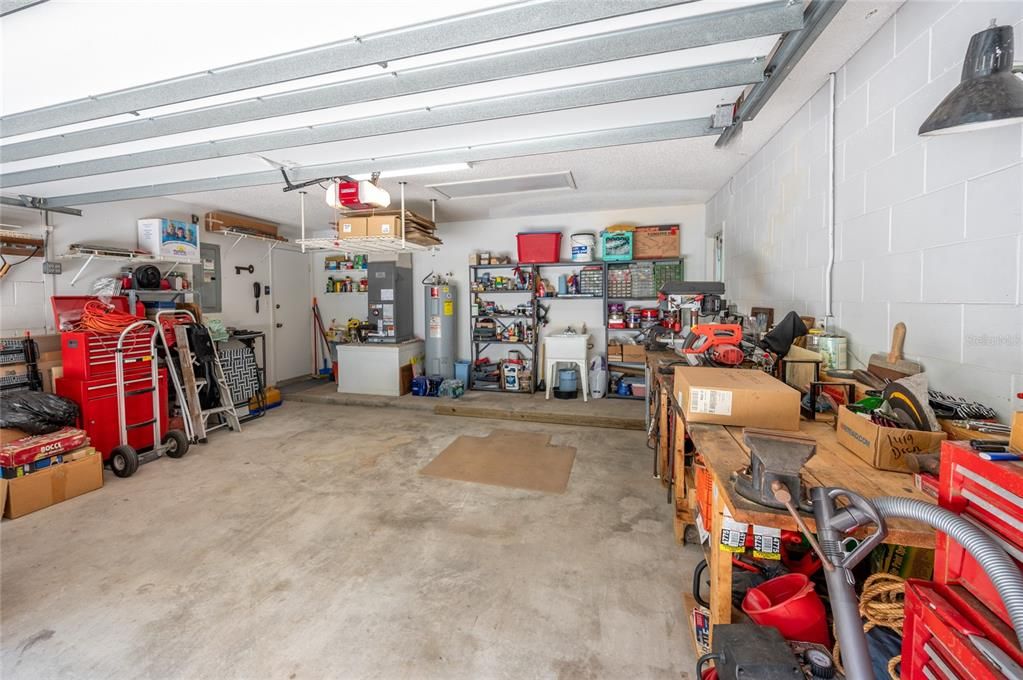 Two car garage with side door to yard (optional workbench)