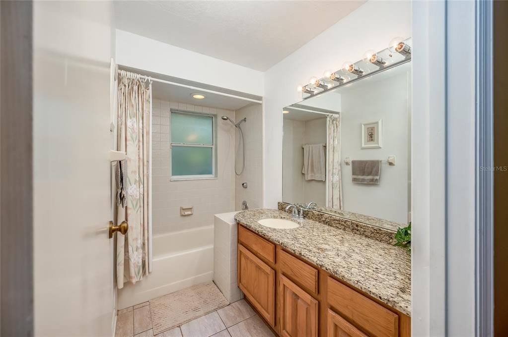 Spacious guest bathroom - oversized vanity and shower/tub combo
