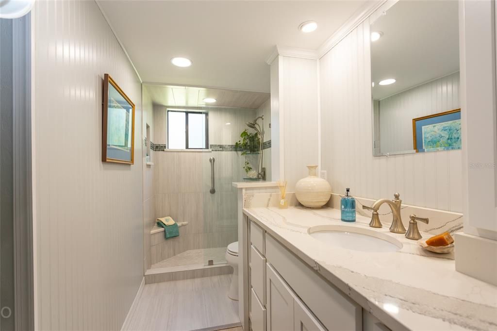 Quartz Counter, Easy Entry Shower with Bench And water Proof Vinyl Plank flooring