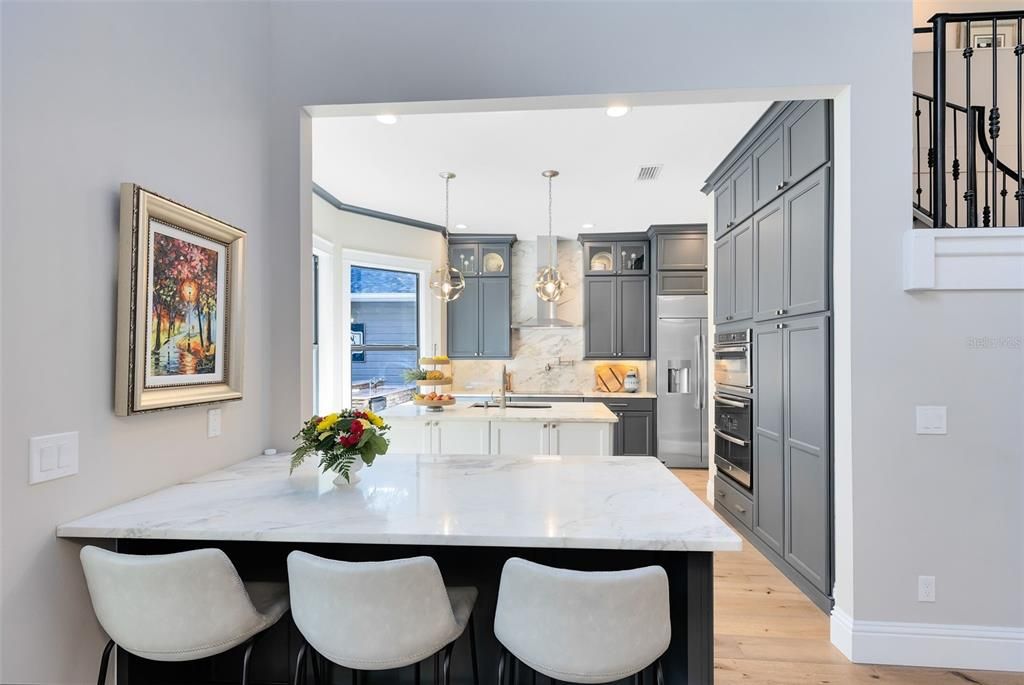 Plenty of seating and storage in this kitchen.  All cabinets feature pull-outs and there is storage under the Island and the Breakfast Bar.