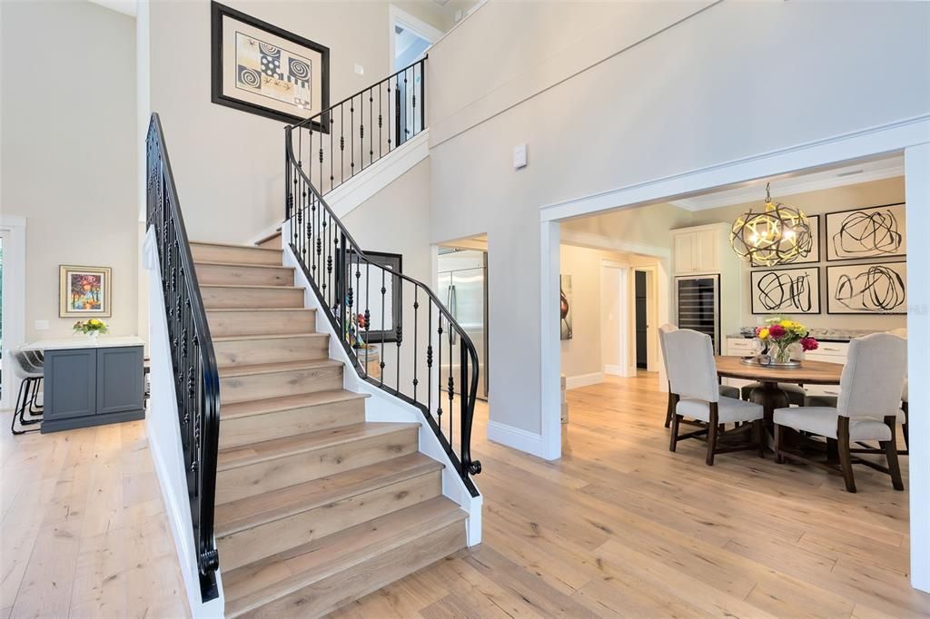 Sweeping stair case, crown molding and custom trim work throughout welcome you to the home.