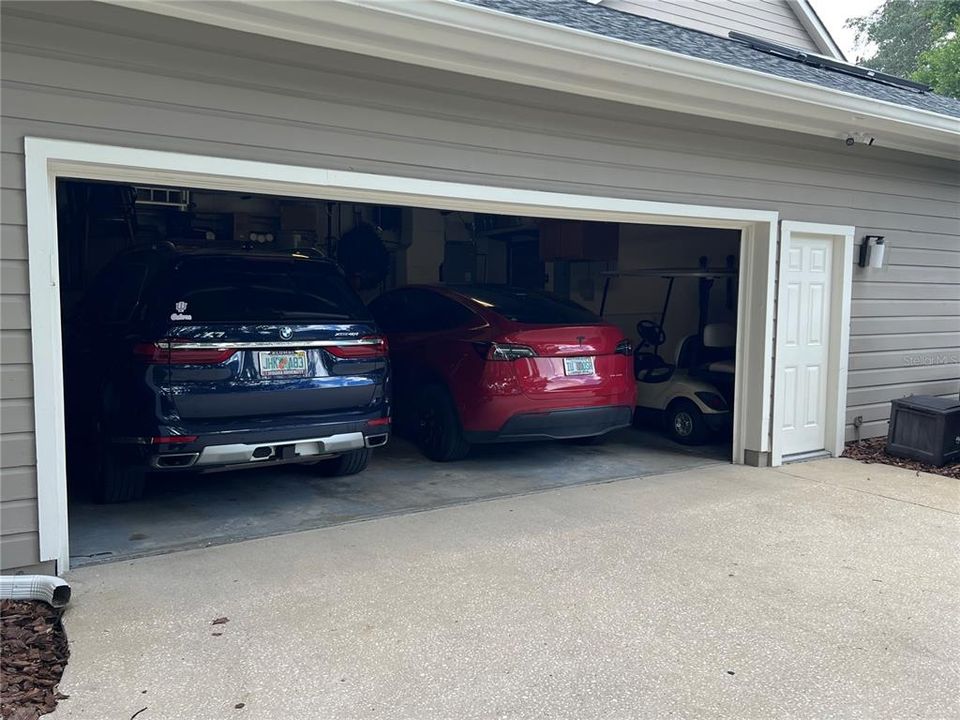 The garage will accommodate a golf cart for fun Country Club Living.