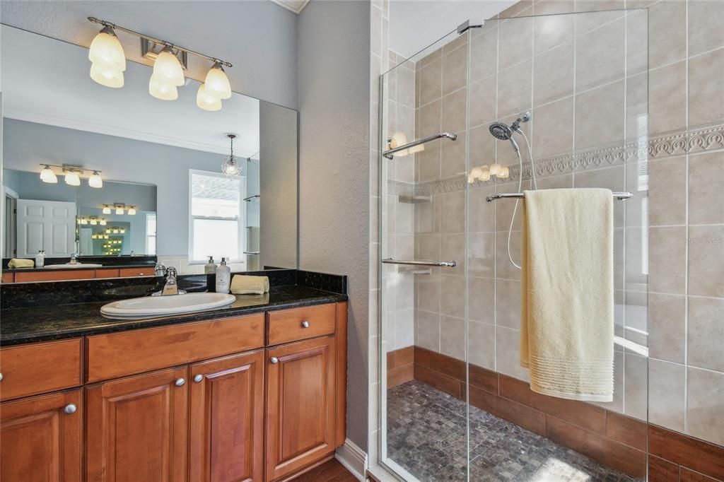 Spa-like shower with seamless glass doors