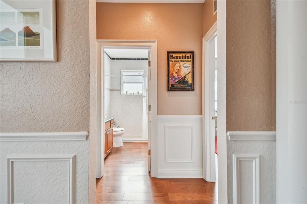 Hallway leading to two large bedrooms and one full bathroom