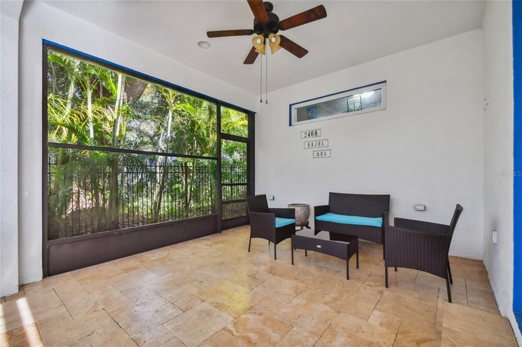 Covered lanai area with plenty of space for indoor/outdoor furniture