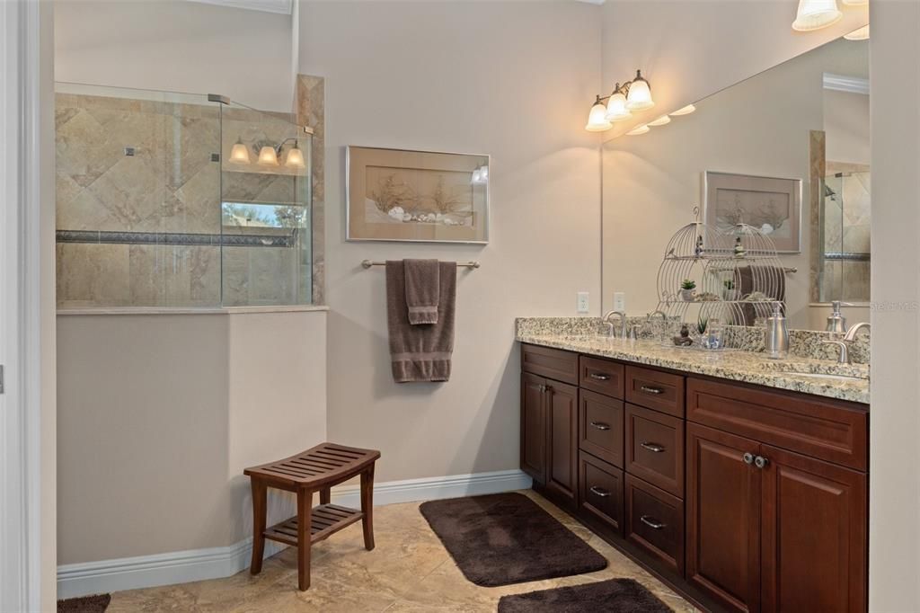 The generous Primary Bath features a Double Vanity and sinks with generous storage.