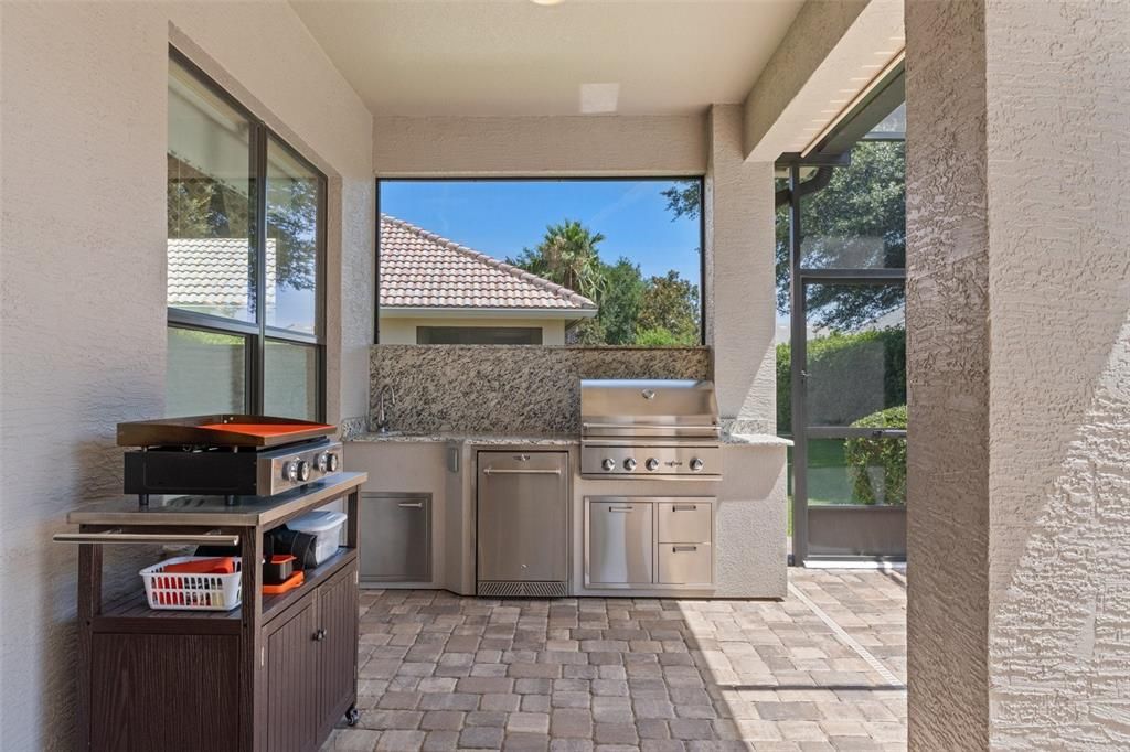 You'll love this Summer Kitchen, complete with Natural Gas Grill, Counter Fridge, and sink.