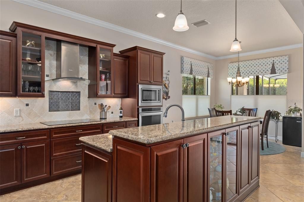 The classic Crown Molding even extends into the kitchen. Another unique feature is the built in storage and display cabinet on the Great Room side of the Kitchen Island, adding that extra special touch of class.