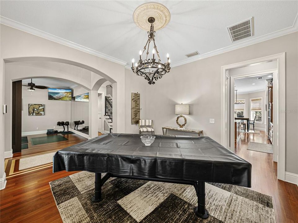 Formal dining room being used as pool room