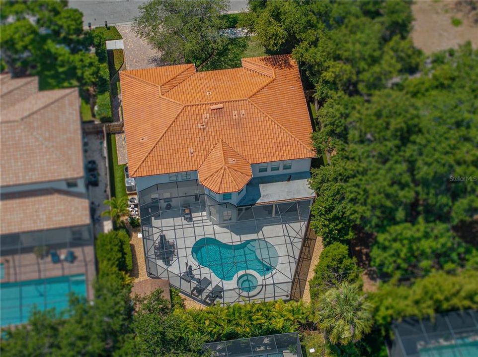 View of back of home and pool