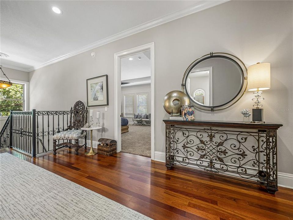 Hallway on second floor with primary bedroom door forward