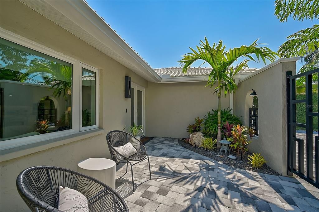 Lush Tropical Landscaping Providing Privacy for Courtyard Entrance