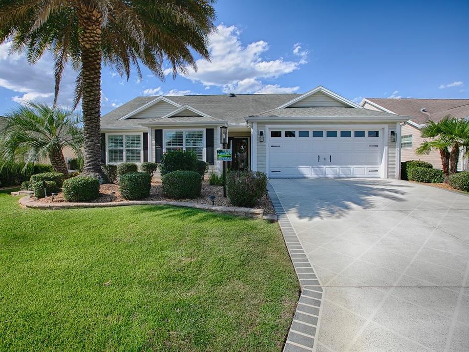 LOVELY CURB APPEAL ON THIS 3/2 OPEN KITCHEN WHISPERING PINE DESIGNER LOCATED IN THE VILLAGE OF DUVAL.