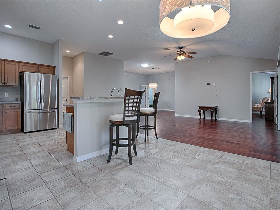 TILE FLOORING IN THE KITCHEN AND CASUAL DINING AREA.