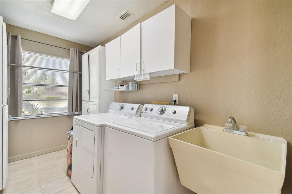Laundry room with task sink & cabinets