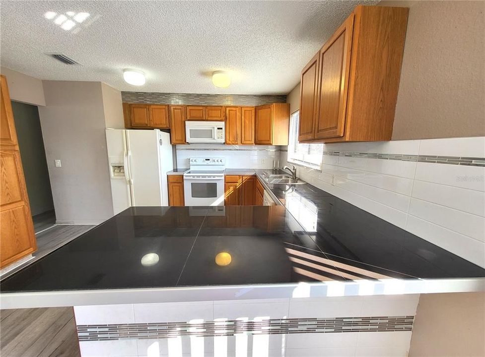 The polished slab counter tops were custom made.