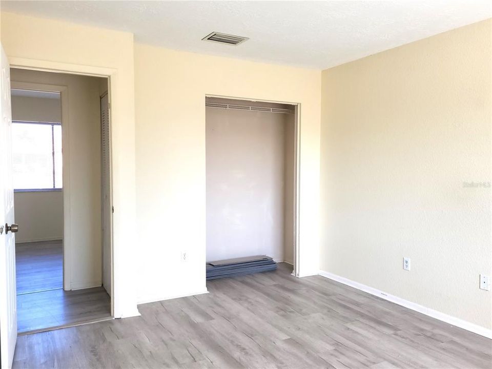 Extra pieces of LVP flooring seen in closet.