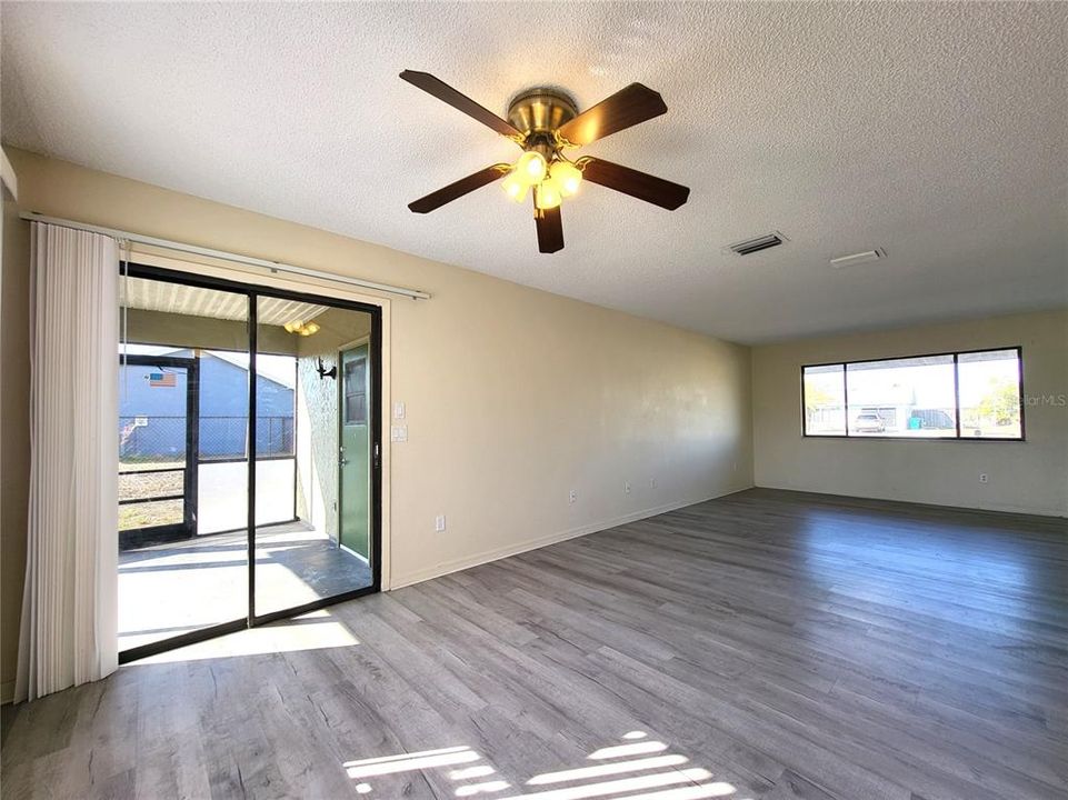 Sliding glass doors lead out to the lanai and converted garage.